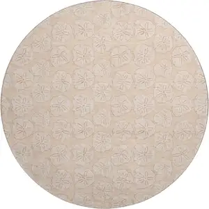 Photo of 8' Apricot And Ivory Geometric Washable Round Rug With UV Protection