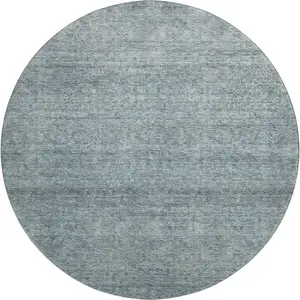 Photo of 8' Aqua And Beige Abstract Washable Round Rug With UV Protection