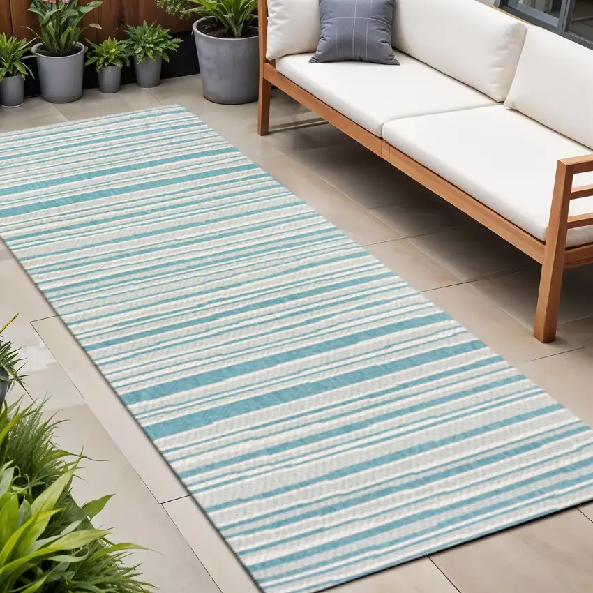 8' Aqua And Cream Striped Indoor Outdoor Runner Rug Photo 1