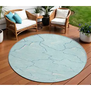 Photo of 8' Aqua And Ivory Round Abstract Washable Indoor Outdoor Area Rug