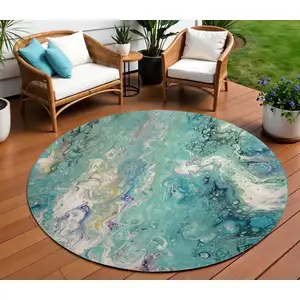 Photo of 8' Aqua And Ivory Round Abstract Washable Indoor Outdoor Area Rug