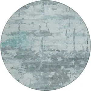 Photo of 8' Aqua And Ivory Round Abstract Washable Indoor Outdoor Area Rug