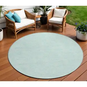 Photo of 8' Aqua And Ivory Round Geometric Washable Indoor Outdoor Area Rug