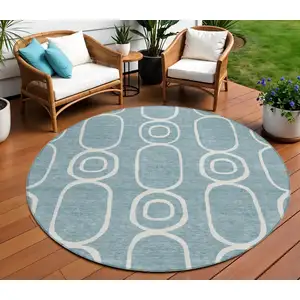 Photo of 8' Aqua And Ivory Round Geometric Washable Indoor Outdoor Area Rug