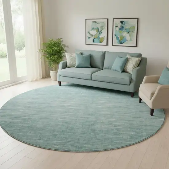 8' Aqua And Teal Abstract Washable Round Rug With UV Protection Photo 1