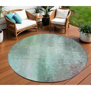Photo of 8' Aqua And Teal Blue Round Abstract Washable Indoor Outdoor Area Rug