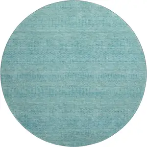 Photo of 8' Aqua And Teal Striped Washable Round Rug With UV Protection