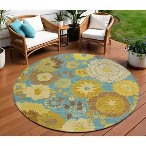 Photo of 8' Aqua Gold And Beige Round Floral Washable Indoor Outdoor Area Rug