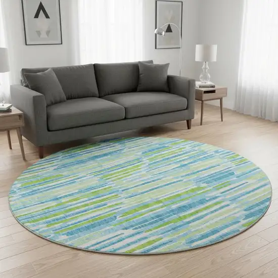 8' Aqua Green And Ivory Abstract Washable Round Rug With UV Protection Photo 2