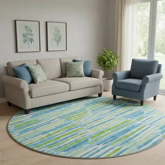 8' Aqua Green And Ivory Abstract Washable Round Rug With UV Protection Photo 1