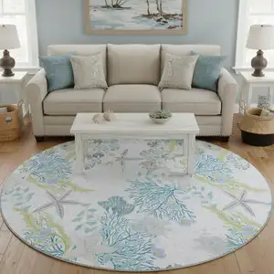 Photo of 8' Aqua Ivory And Green Geometric Washable Round Rug With UV Protection