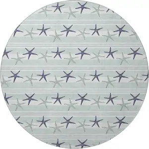 Photo of 8' Aqua Navy Blue And Ivory Geometric Washable Round Rug With UV Protection