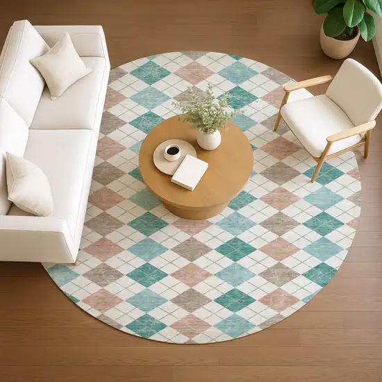 8' Aqua Peach And Ivory Round Geometric Washable Indoor Outdoor Area Rug Photo 9
