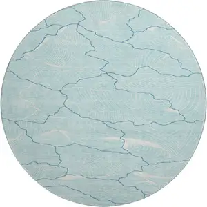 Photo of 8' Aqua Teal And Ivory Abstract Washable Round Rug With UV Protection