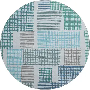 Photo of 8' Aqua Teal And Ivory Geometric Washable Round Rug With UV Protection