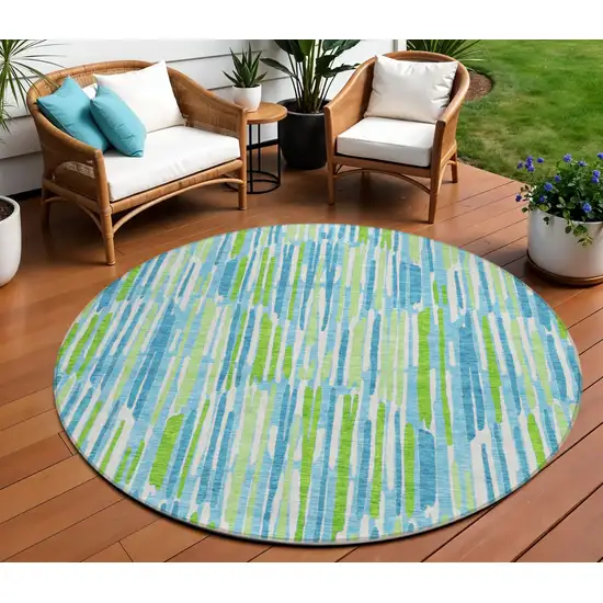 8' Aqua Teal Blue And Lime Green Round Abstract Washable Indoor Outdoor Area Rug Photo 1