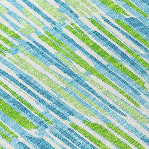 Photo of 8' Aqua Teal Blue And Lime Green Round Abstract Washable Indoor Outdoor Area Rug