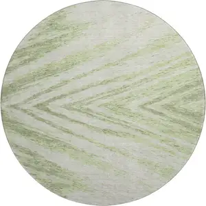 Photo of 8' Artichoke Green And Beige Abstract Washable Round Rug With UV Protection