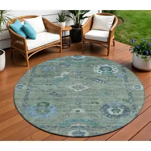 Photo of 8' Artichoke Green And Denim Blue Round Floral Medallion Washable Indoor Outdoor Area Rug