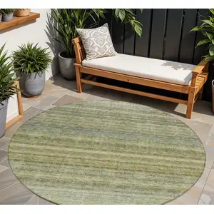 Photo of 8' Artichoke Green And Gray Round Striped Washable Indoor Outdoor Area Rug