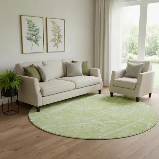 8' Artichoke Green And Ivory Abstract Washable Round Rug With UV Protection Photo 1