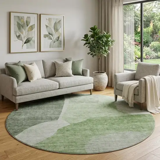 8' Artichoke Green And Ivory Abstract Washable Round Rug With UV Protection Photo 1