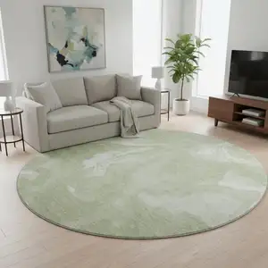 Photo of 8' Artichoke Green And Ivory Abstract Washable Round Rug With UV Protection