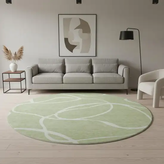 8' Artichoke Green And Ivory Abstract Washable Round Rug With UV Protection Photo 2