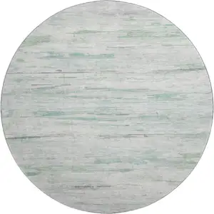 Photo of 8' Artichoke Green And Ivory Abstract Washable Round Rug With UV Protection