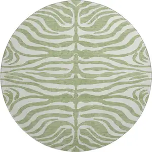 Photo of 8' Artichoke Green And Ivory Animal Print Washable Round Rug With UV Protection