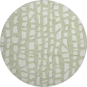 Photo of 8' Artichoke Green And Ivory Cobblestone Washable Round Rug With UV Protection