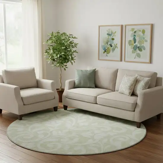 8' Artichoke Green And Ivory Floral Washable Round Rug With UV Protection Photo 1