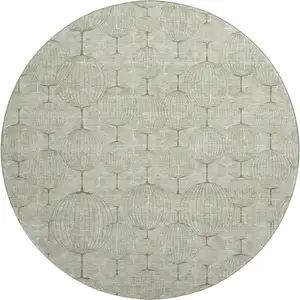 Photo of 8' Artichoke Green And Ivory Geometric Washable Round Rug With UV Protection