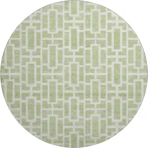 Photo of 8' Artichoke Green And Ivory Geometric Washable Round Rug With UV Protection