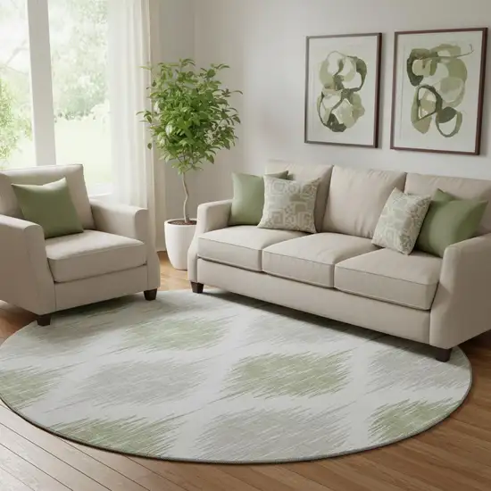 8' Artichoke Green And Ivory Ikat Washable Round Rug With UV Protection Photo 1