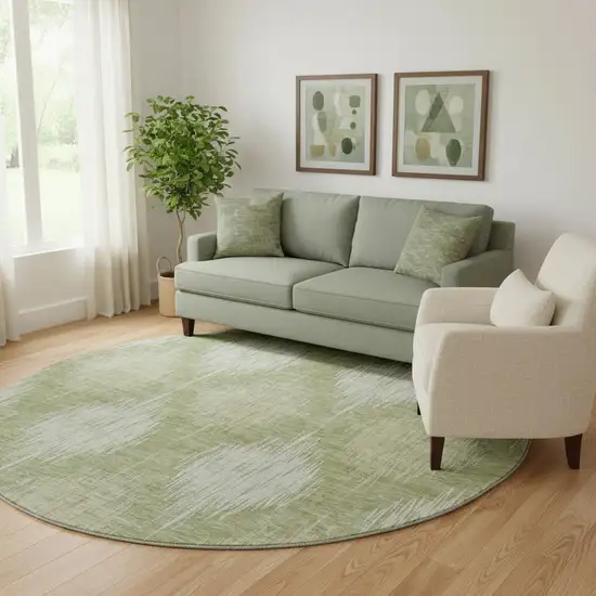 8' Artichoke Green And Ivory Ikat Washable Round Rug With UV Protection Photo 1