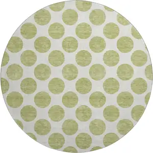 Photo of 8' Artichoke Green And Ivory Polka Dot Washable Round Rug With UV Protection