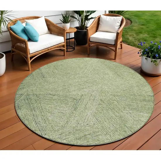 8' Artichoke Green And Ivory Round Abstract Washable Indoor Outdoor Area Rug Photo 1