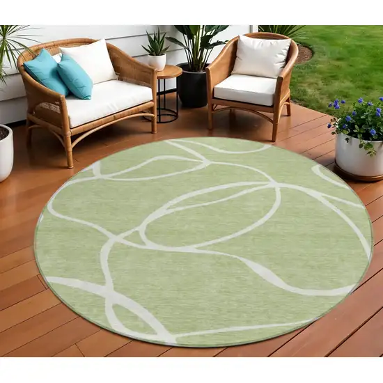8' Artichoke Green And Ivory Round Abstract Washable Indoor Outdoor Area Rug Photo 1