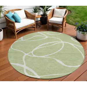Photo of 8' Artichoke Green And Ivory Round Abstract Washable Indoor Outdoor Area Rug