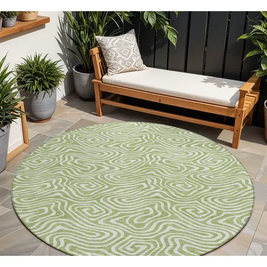 8' Artichoke Green And Ivory Round Abstract Washable Indoor Outdoor Area Rug Photo 1