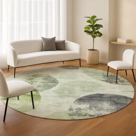 8' Artichoke Green And Ivory Round Abstract Washable Indoor Outdoor Area Rug Photo 9