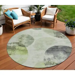 Photo of 8' Artichoke Green And Ivory Round Abstract Washable Indoor Outdoor Area Rug