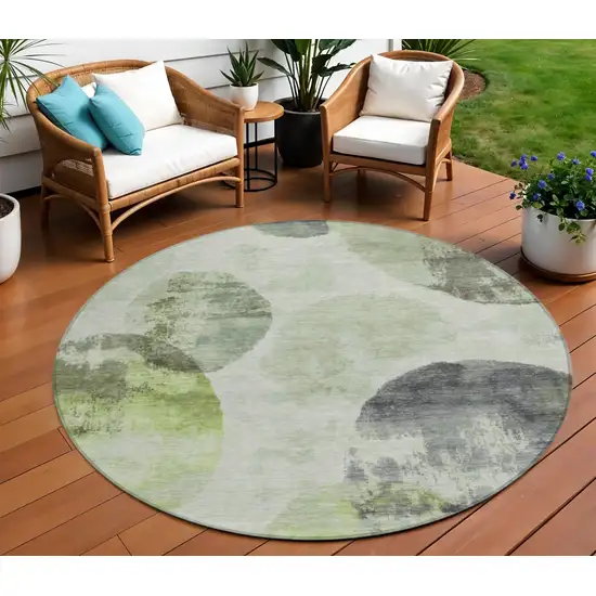 8' Artichoke Green And Ivory Round Abstract Washable Indoor Outdoor Area Rug Photo 1