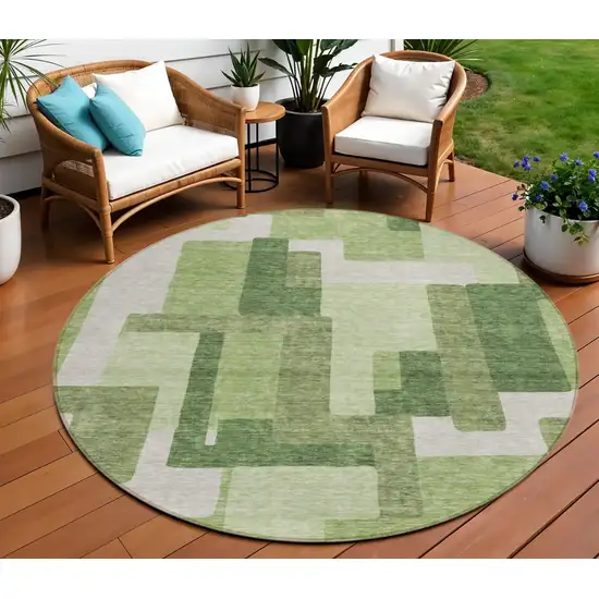 8' Artichoke Green And Ivory Round Abstract Washable Indoor Outdoor Area Rug Photo 1