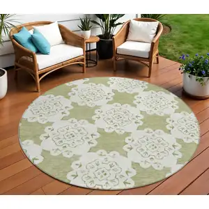 Photo of 8' Artichoke Green And Ivory Round Quatrefoil Washable Indoor Outdoor Area Rug