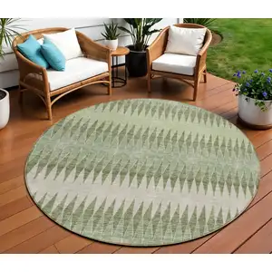 Photo of 8' Artichoke Green And Light Green Round Striped Washable Indoor Outdoor Area Rug