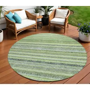 Photo of 8' Artichoke Green And Olive Green Round Striped Washable Indoor Outdoor Area Rug