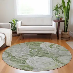 Photo of 8' Artichoke Green And Silver Round Geometric Washable Indoor Outdoor Area Rug
