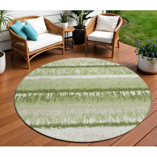 8' Artichoke Green Beige And Ivory Round Striped Washable Indoor Outdoor Area Rug Photo 1